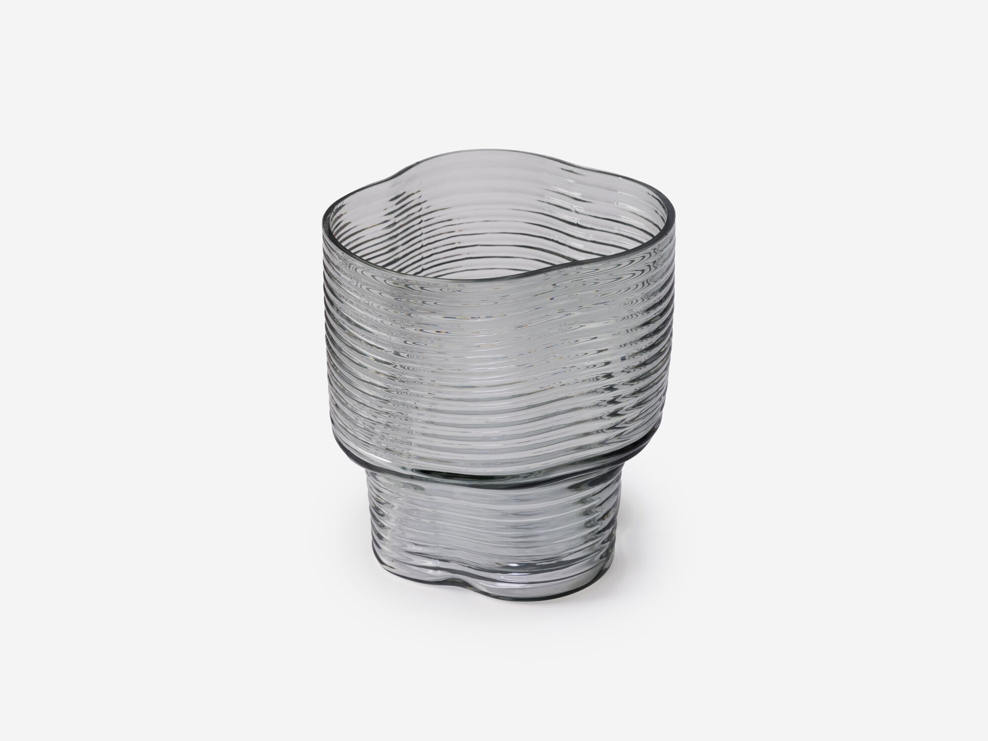 Angle view of large ridged glass flower vase